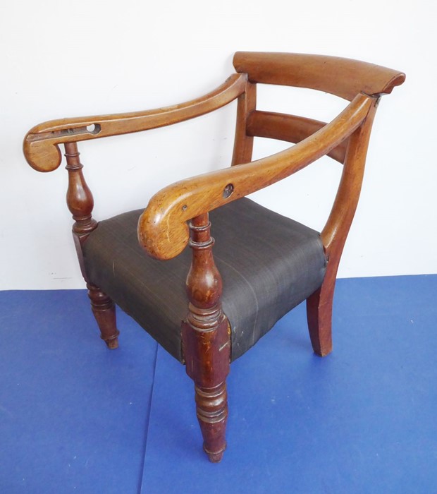 A late Regency period mahogany open-armed child's chair on turned front legs