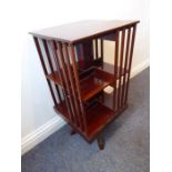 A mahogany revolving bookcase on stand, probably early/mid-20th century (38cm wide x 76cm high)