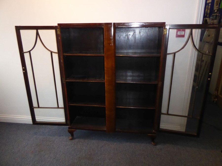A 1920s/1930s two-door walnut display cabinet; pagoda-style astragal glazing bars and raised on - Image 4 of 7