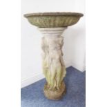 A reconstituted stone bird bath on octagonal base; the separate circular weathered lobed top