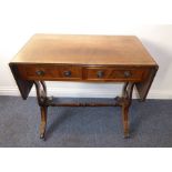 A reproduction mahogany Regency-style sofa table; two true and two dummy drawers opposing, reeded-