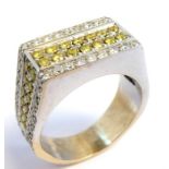 A diamond-set dress ring; the top and sides set with two lines of yellow brilliant-cut diamonds (