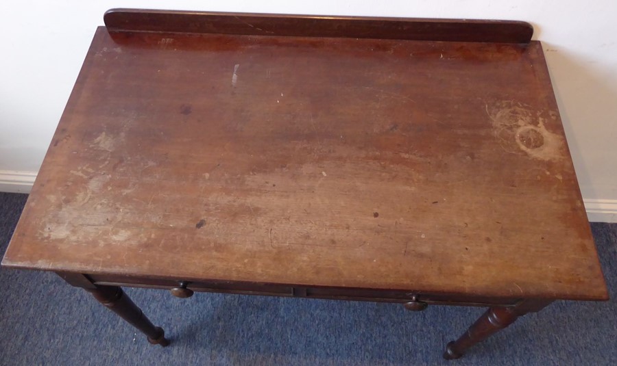 A mid-19th century mahogany side/writing table; the overhanging top with galleried back above two - Image 3 of 5