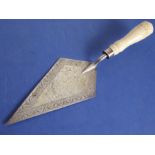 A late 19th century lozenge-shaped presentation hallmarked silver trowel having beautifully carved