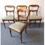 A set of four circa 1840 mahogany balloon-back dining chairs; scrolling crest rails, drop-in seats