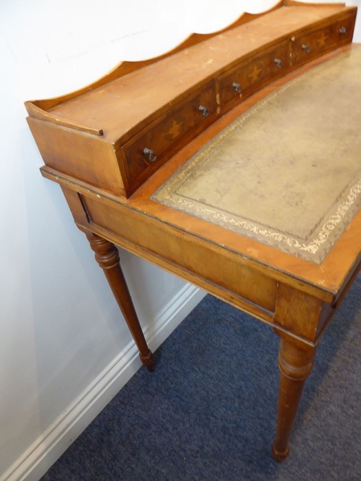 A reproduction yew-wood writing desk; the galleried superstructure with three concave drawers headed - Image 6 of 7