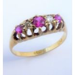 An early 20th century pink sapphire and diamond five-stone ring set with three pink sapphires (