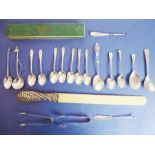 A selection of silverware; to include 14 spoons (mostly teaspoons and to include a shell-shaped