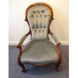 A mid-19th century mahogany show-wood frame and button-back upholstered spoon-back open armchair;