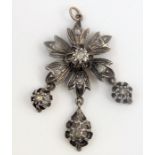 A early/mid-19th century diamond-set and silver pendant, the flower-head cluster suspending three