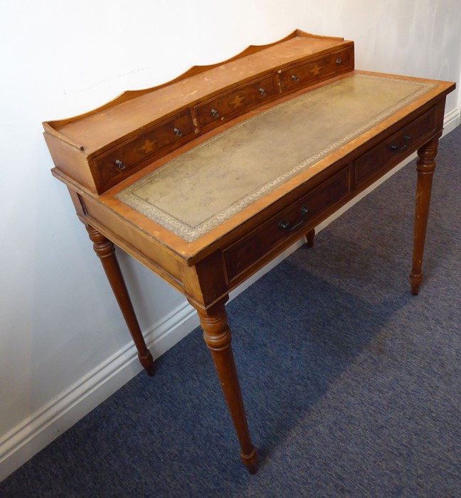 A reproduction yew-wood writing desk; the galleried superstructure with three concave drawers headed - Image 5 of 7