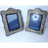 A pair of ornate silver-plated photo frames