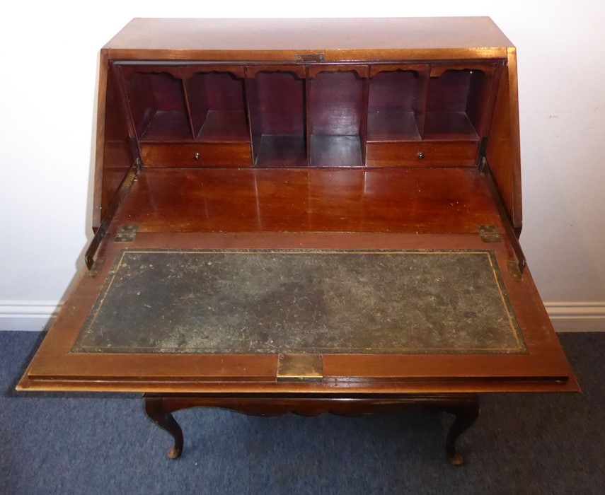 An early 20th century walnut writing bureau; the quarter-veneered sloping fall opening to reveal - Image 6 of 7