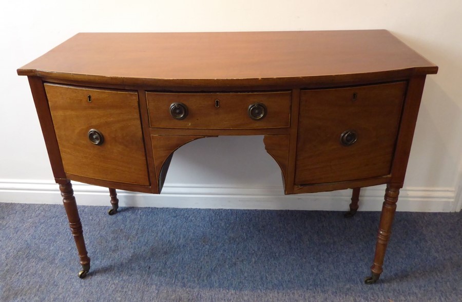 An early 19th century bow-fronted mahogany sideboard of small proportions; the central drawer - Image 2 of 6