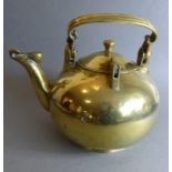 An unusual and heavy late 19th/early 20th century brass kettle of spherical shape (possibly