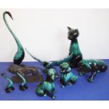 Eight green glazed ceramic animals including dogs, a cat and an open-winged bird (the tallest 46.5cm
