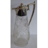 A late 19th century baluster-shaped glass claret jug with silver-plated mounts; the main body very