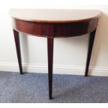 A George III period demi-lune mahogany side table raised on square tapering legs (81cm widest)