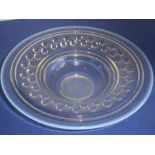 A large and heavy Art Deco period circular glass bowl with opalescent rim and inner border of half