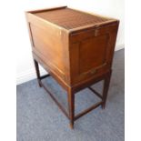 An early 20th century oak tambour-topped cabinet-on-stand with square tapering legs