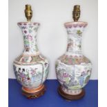 Two similar Chinese baluster-shaped porcelain lamps; hand decorated in the famille rose palette (