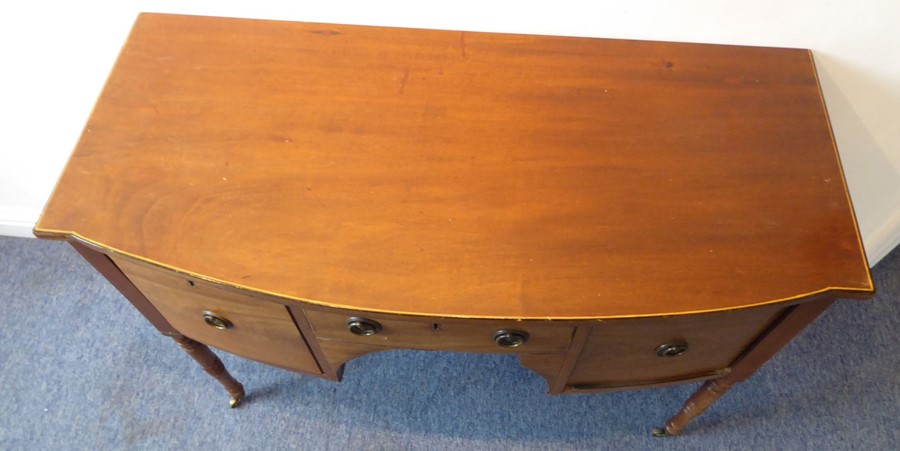 An early 19th century bow-fronted mahogany sideboard of small proportions; the central drawer - Image 3 of 6