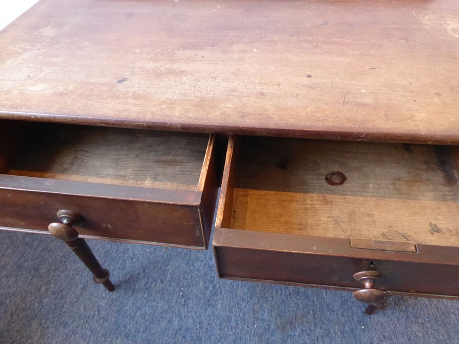A mid-19th century mahogany side/writing table; the overhanging top with galleried back above two - Image 5 of 5