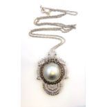 A mabé pearl and diamond-set pendant, the central mabé pearl measuring 15mm approx. in diameter