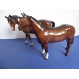 Two Beswick horses; brown glaze, one standing four square the other walking and with head turned