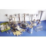 A good selection of silver plate to include a pair of three-light candelabra, a large trumpet-shaped