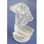 A small frosted glass sculpture/paperweight modelled as a naked kneeling maiden with her long