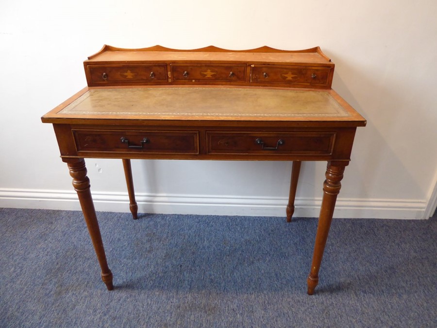 A reproduction yew-wood writing desk; the galleried superstructure with three concave drawers headed - Image 2 of 7