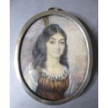 A well-executed framed and glazed portrait miniature of a young woman