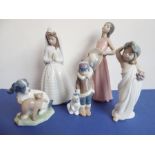 Three Lladro and two Nao porcelain figures; the Nao figures of a girl in first communion dress (23cm