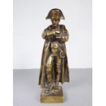 A heavy 19th century cast-brass model of Napoleon; in full uniform with long coat and sword to his