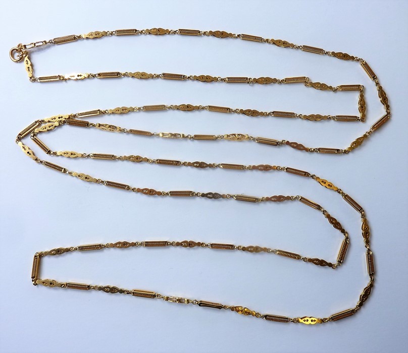 A heavy fancy link long chain necklace of alternating rectangular and double pear-shaped openwork