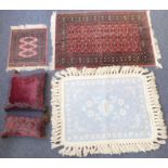 A blue and white woollen rug (98 x 75cm excluding tassels), two small Pakistan Belouch carpets of