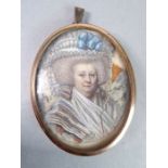 A mid-19th century Continental oval portrait miniature within gilded frame; shoulder-length portrait