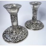 A pair or ornate silver dwarf candlesticks, Birmingham 1967