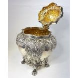 An ornate silver tea caddy with 1899 Chester hallmark (174g) (approx. 12.5cm high)(All in good