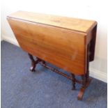 An Edwardian period dropleaf walnut Sutherland table; turned annulated supports terminating in