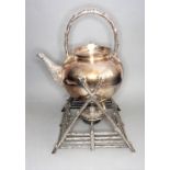 An unusual late 19th century silver-plated spirit kettle on stand; turned ivory finial, the
