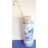 A large Chinese cylindrical porcelain vase decorated with exotic birds and with lotus-style base,