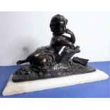 A patinated bronze of a putto reading, with alabaster base (the bronze possibly modern)