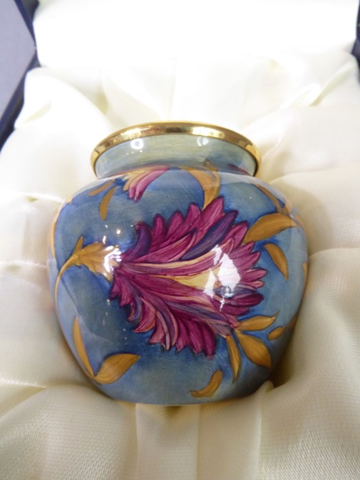 A miniature Moorcroft vase; finely hand-painted enamel fired onto copper, decorated with florid - Image 2 of 5