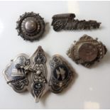 A small selection of mostly 19th century silver brooches and a late 19th/early 20th century