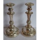 A pair of large and heavy 19th century Sheffield plated candlesticks; the removable drip pans