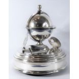 An unusual late 19th century silver-plated musical inkstand; plays three airs, movement with a paper