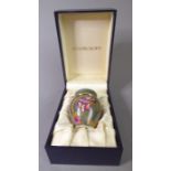 A miniature Moorcroft ovoid vase and cover; finely hand-painted enamel fired onto copper,