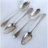 Four early 19th century hallmarked silver serving spoons engraved with armorials (total weight